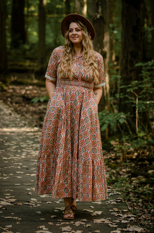 Woman wearing a patterned modest nursing dress