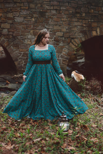 Woman in modest nursing teal dress with lantern