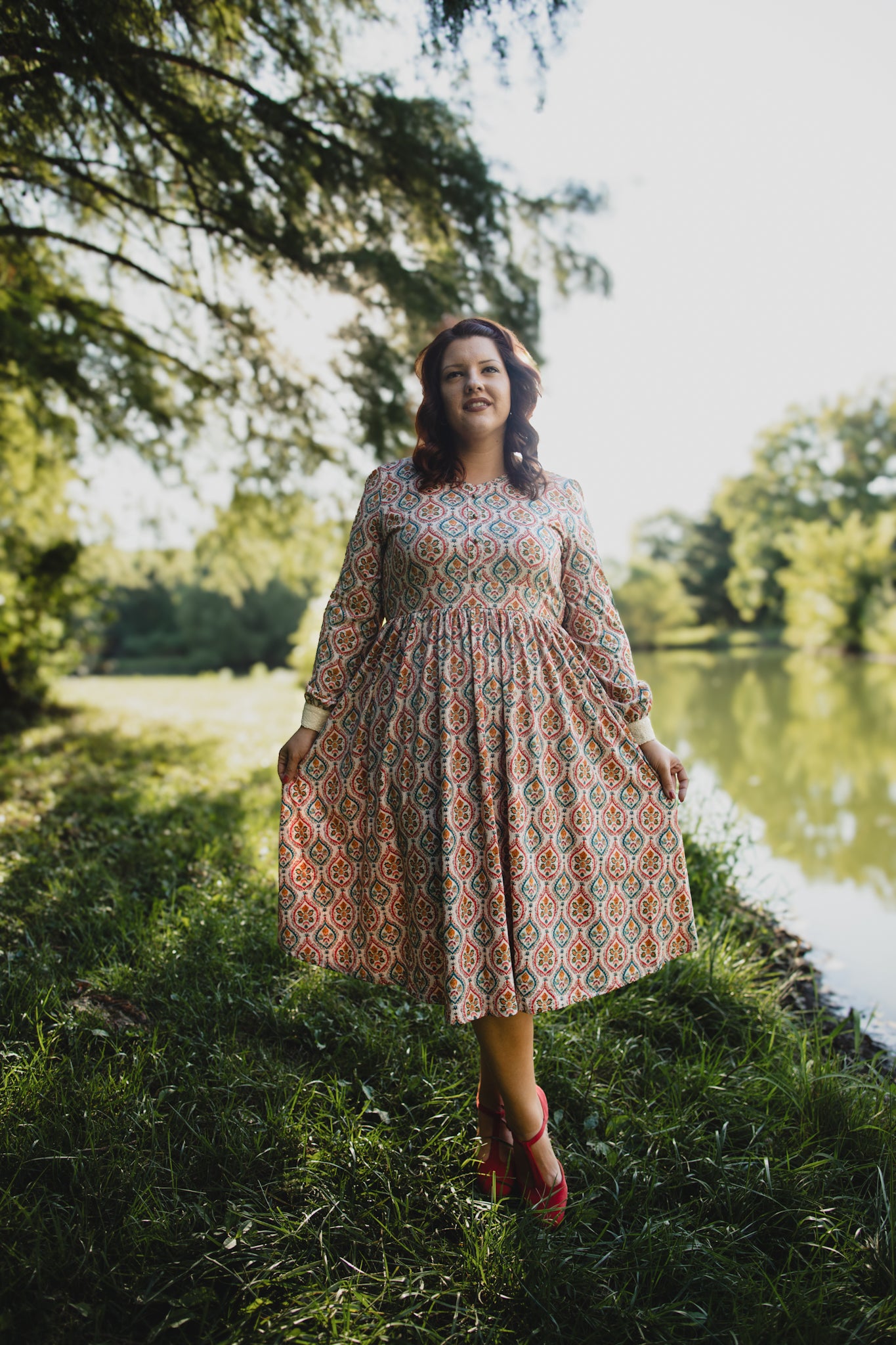 Woman wearing a patterned modest nursing dress