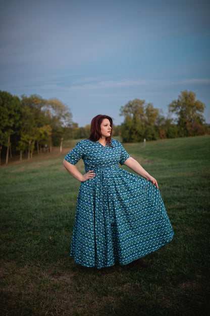 Woman in modest nursing dress in field