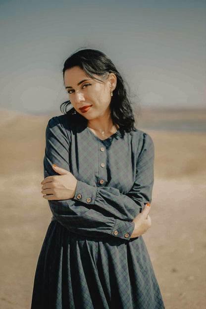 Woman in modest nursing dress desert landscape