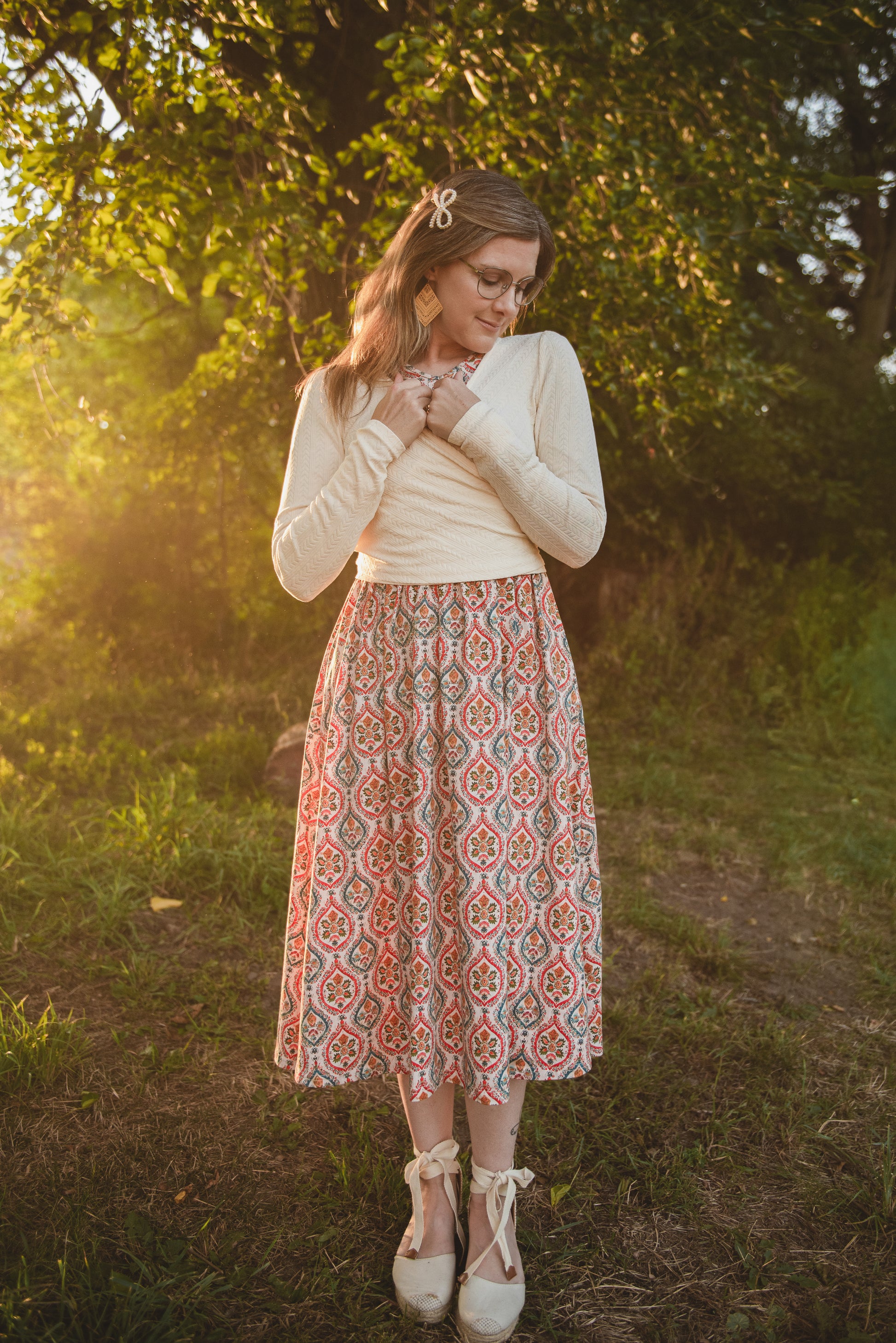 Woman wearing a patterned modest nursing dress