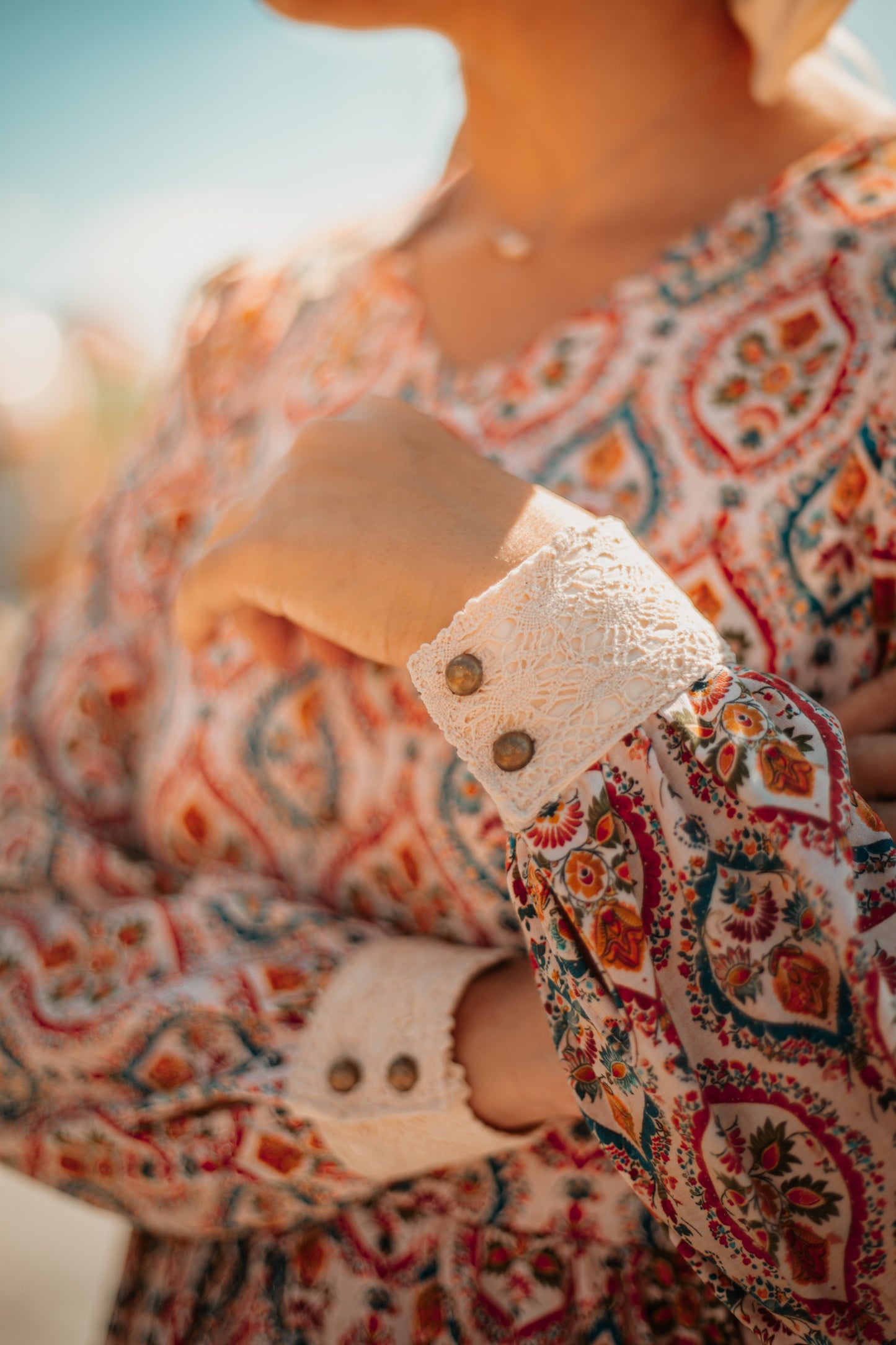 Woman wearing a patterned modest nursing dress