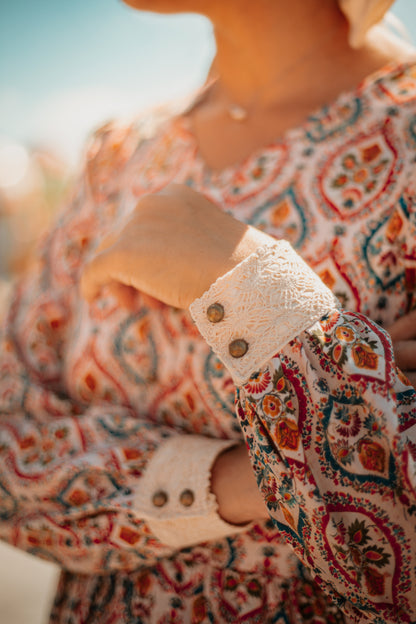 Woman wearing a patterned modest nursing dress