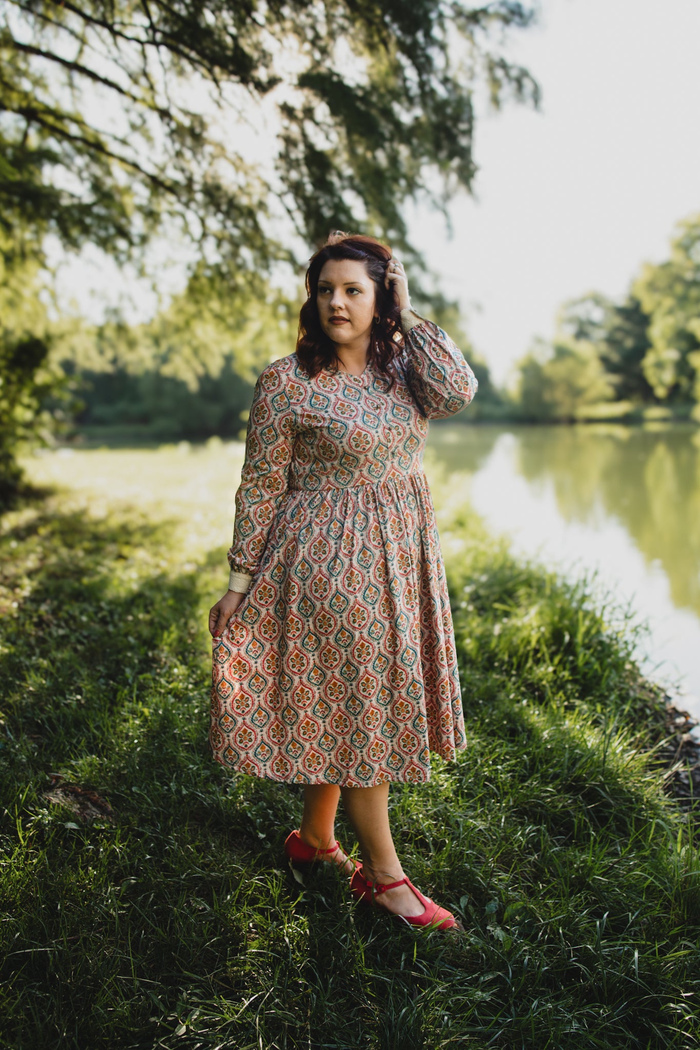 Woman wearing a patterned modest nursing dress