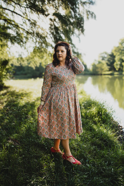 Woman wearing a patterned modest nursing dress