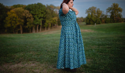 Woman in modest nursing dress in field