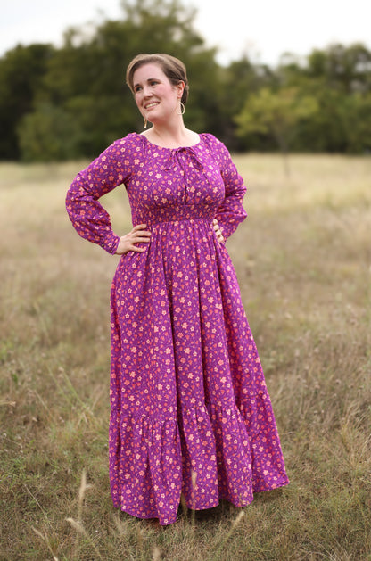 Woman in modest purple nursing dress outdoors