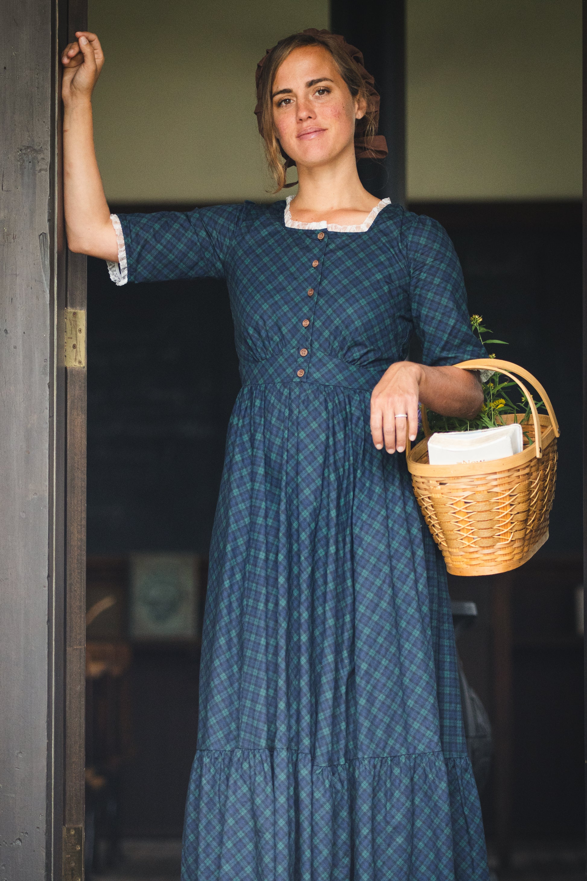 woman wearing a modest nursing blue patterned dress