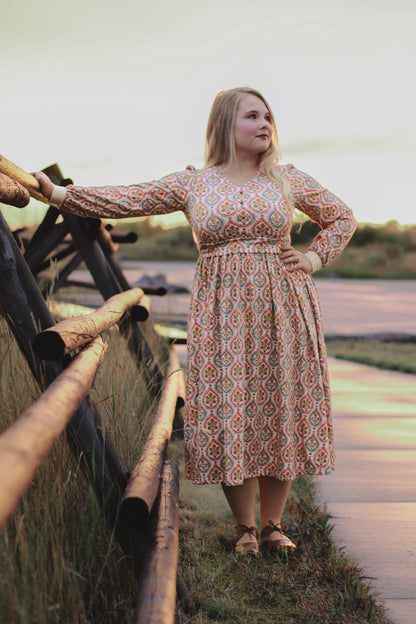 Woman wearing a patterned modest nursing dress