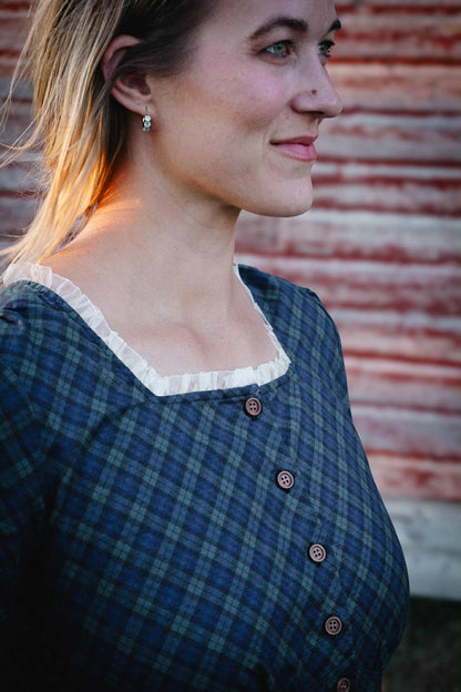 woman wearing a modest nursing blue patterned dress