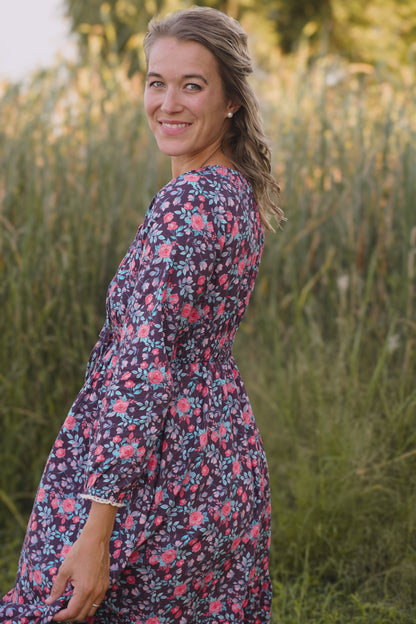 Woman in modest nursing floral dress outdoors
