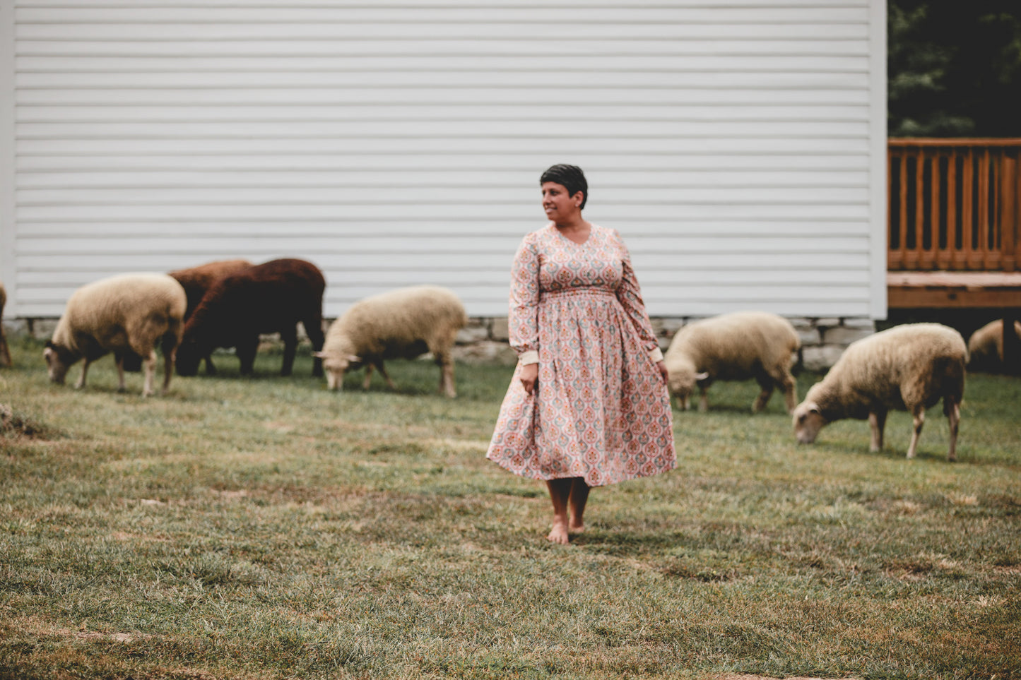 Woman wearing a patterned modest nursing dress