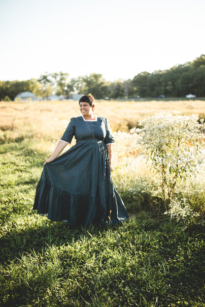 woman wearing a modest nursing blue patterned dress
