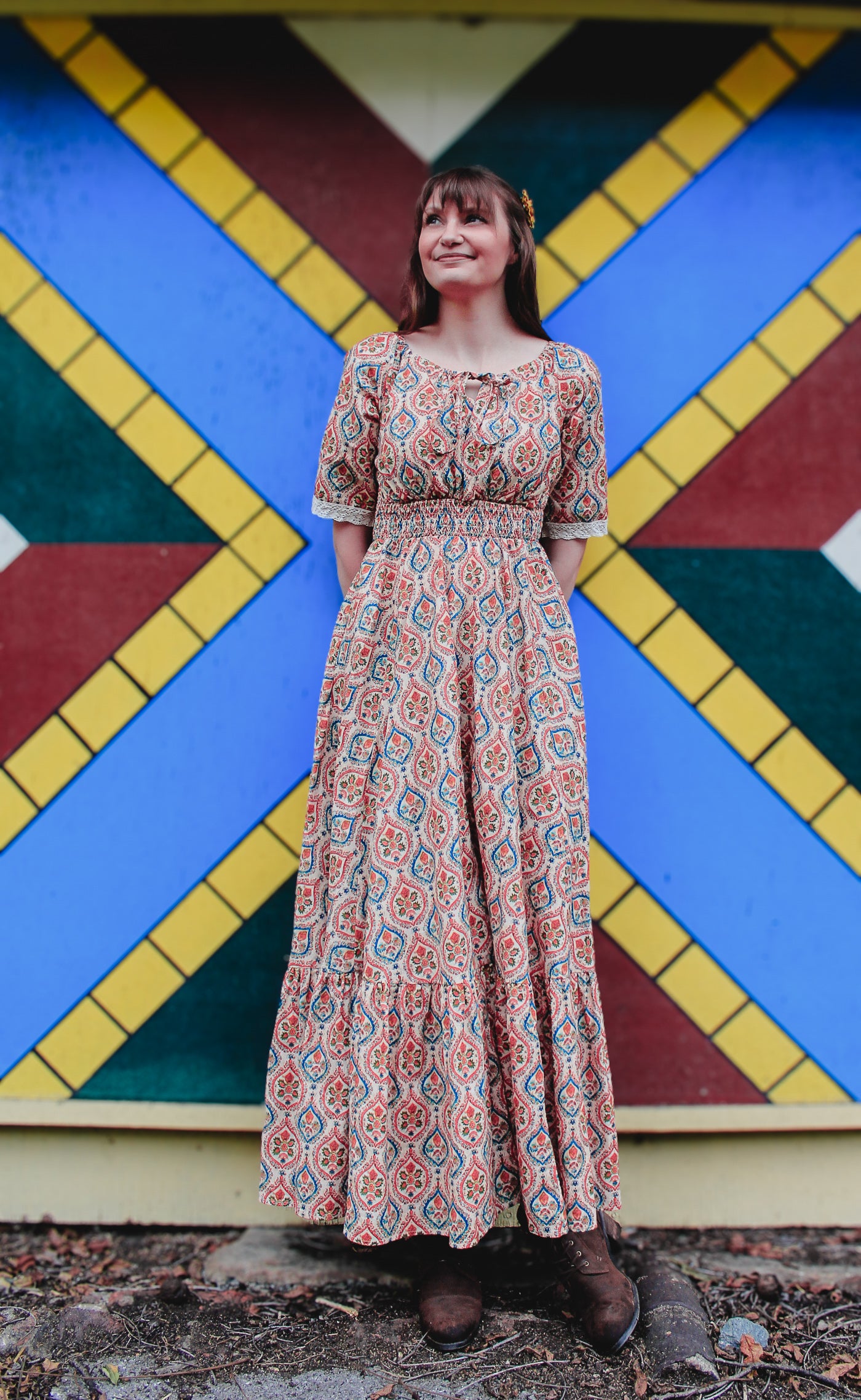 Woman wearing a patterned modest nursing dress
