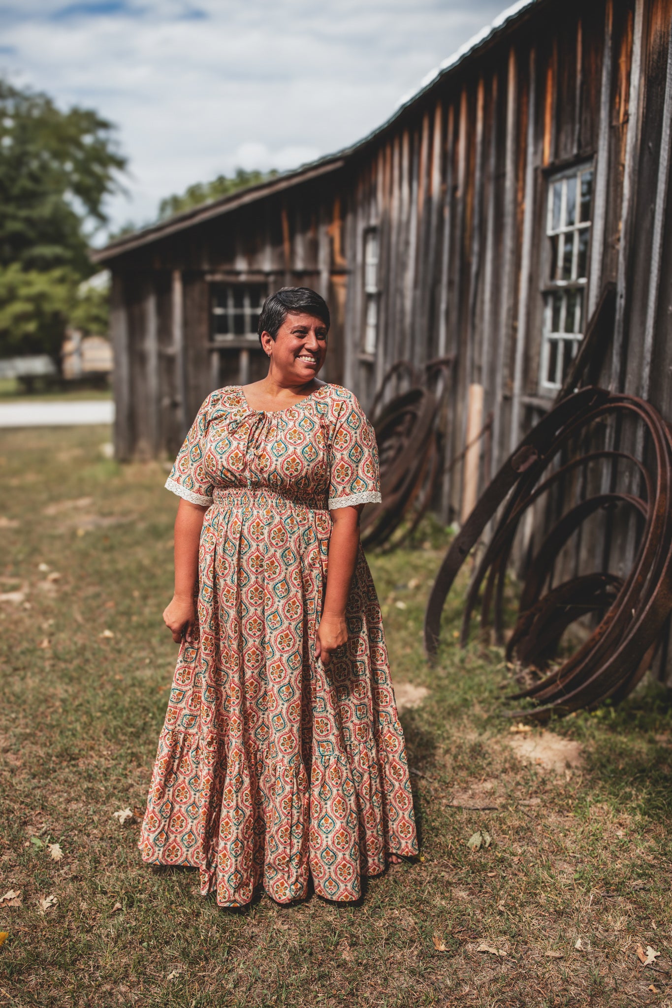 Woman wearing a patterned modest nursing dress