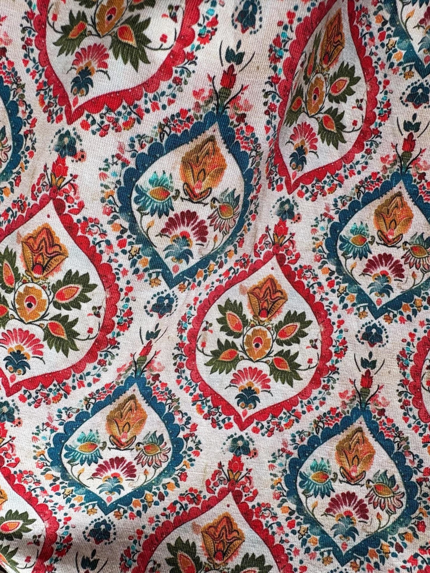 Close-up of a colorful dress with intricate patterns and designs.