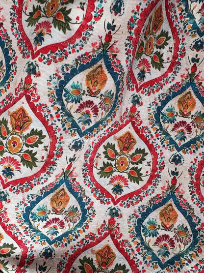 Close-up of a colorful dress with intricate patterns and designs.