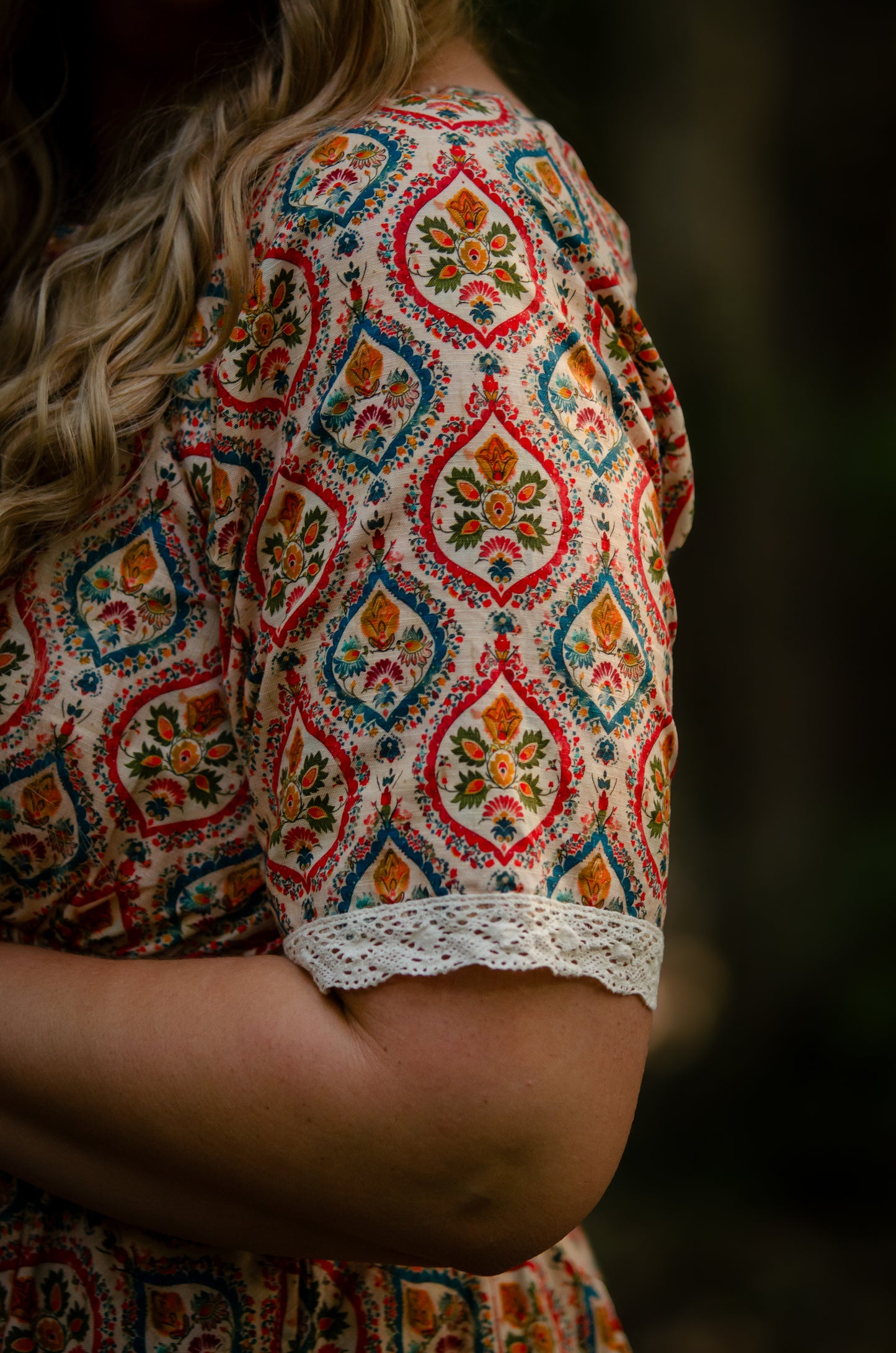 Woman wearing a patterned modest nursing dress