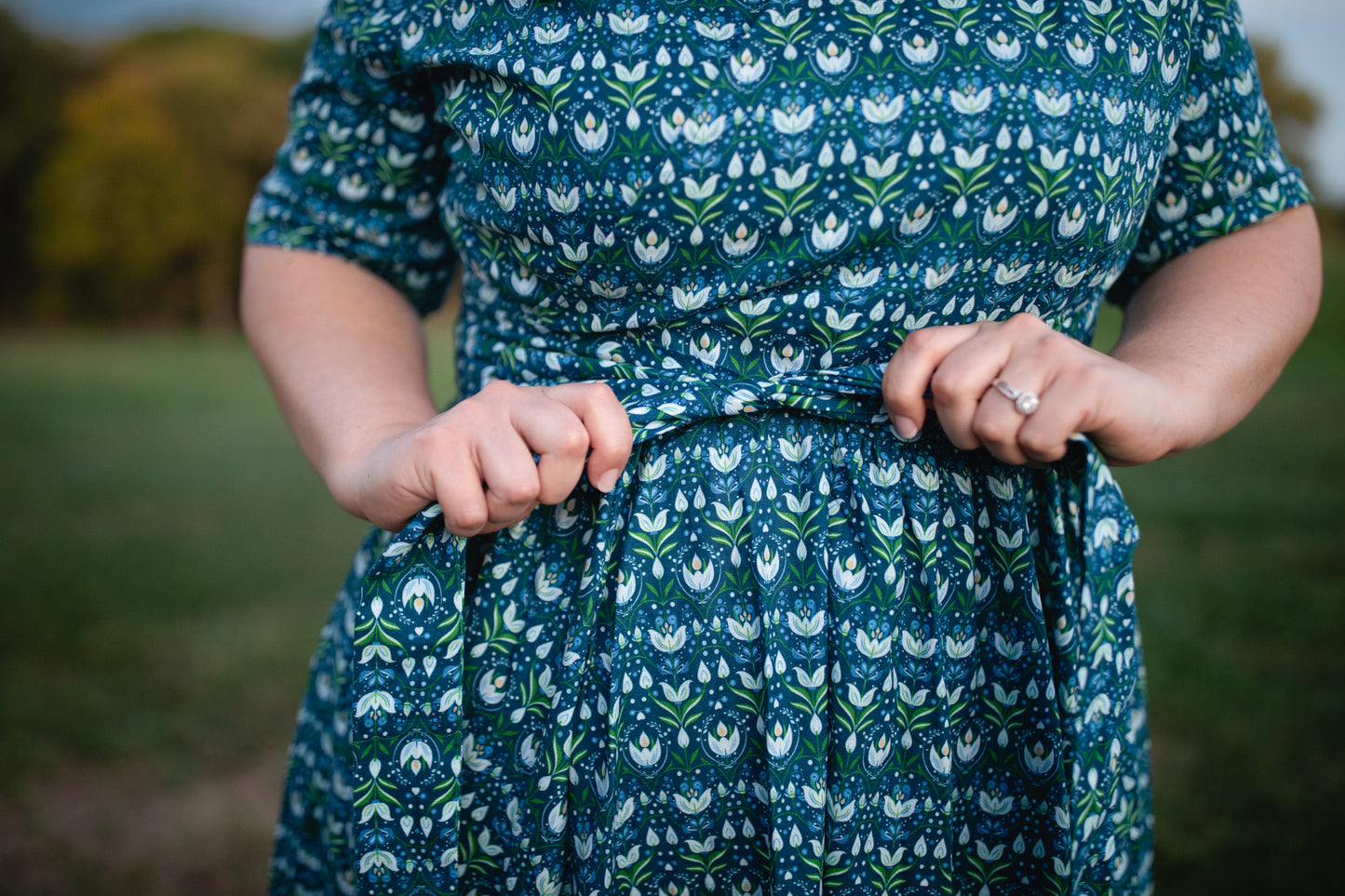 Woman in modest nursing dress outdoors