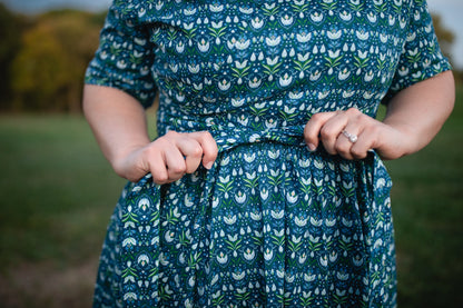 Woman in modest nursing dress outdoors