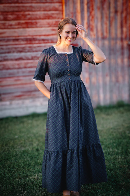 woman wearing a modest nursing blue patterned dress