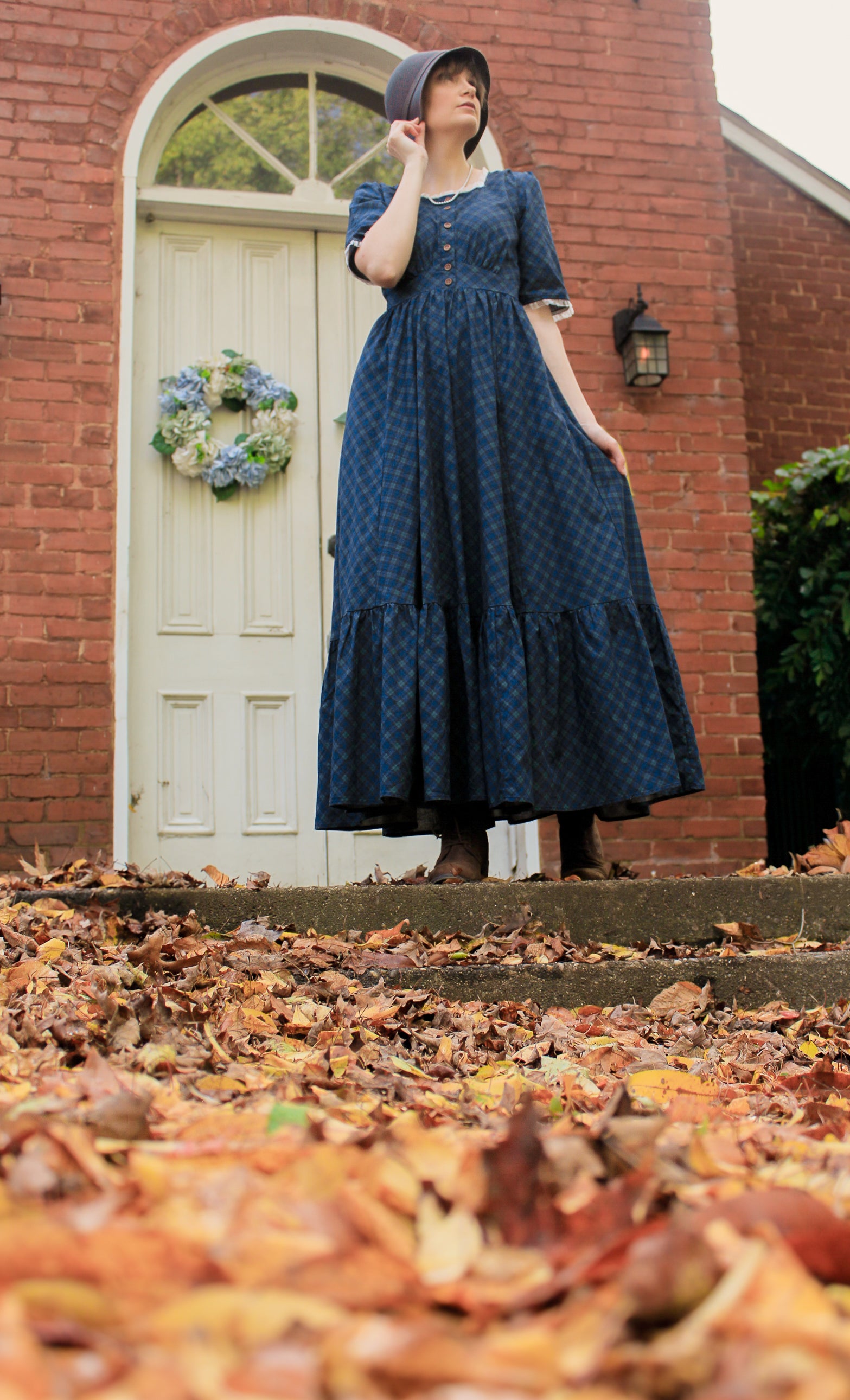 woman wearing a modest nursing blue patterned dress