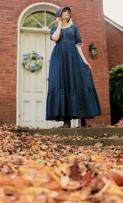 woman wearing a modest nursing blue patterned dress