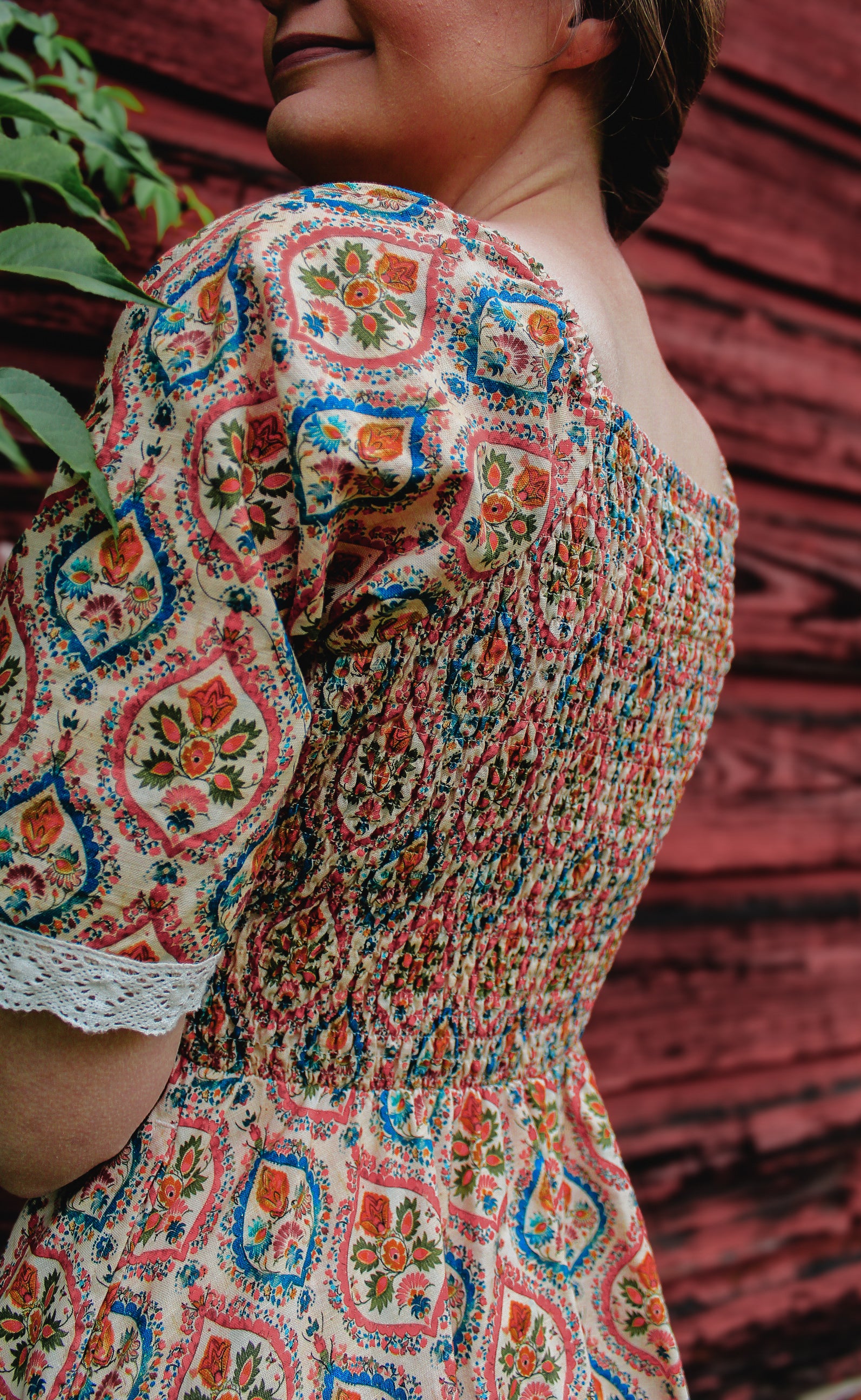 Woman wearing a patterned modest nursing dress