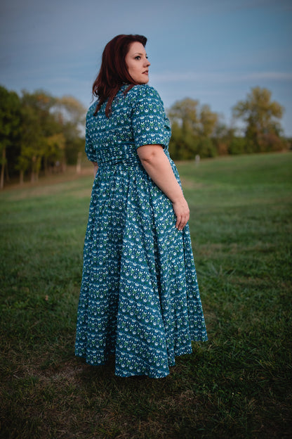 Woman in modest nursing dress in field
