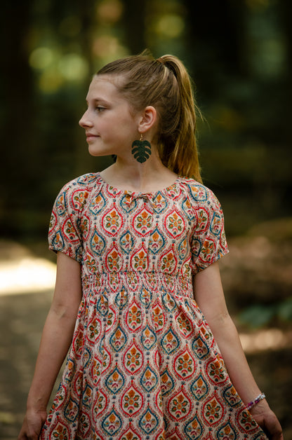 Girl in modest patterned dress outdoors