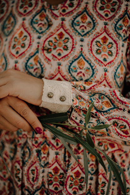 Woman wearing a patterned modest nursing dress