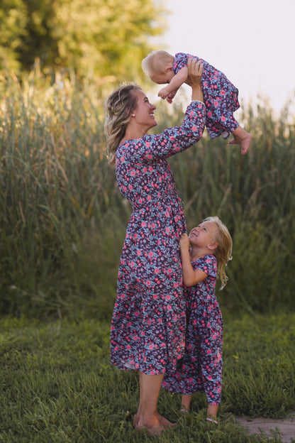 Woman and child in modest nursing dresses