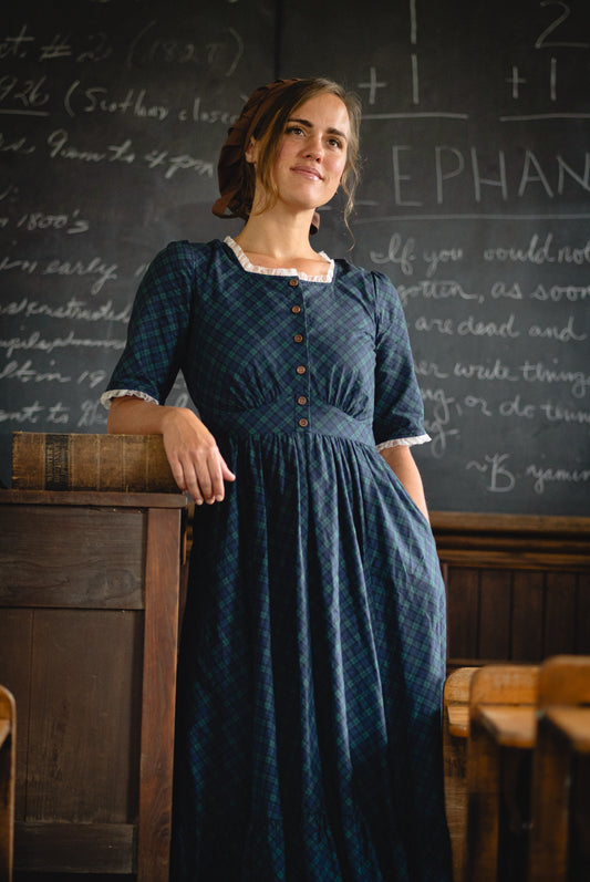 woman wearing a modest nursing blue patterned dress