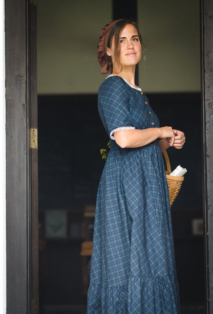 woman wearing a modest nursing blue patterned dress