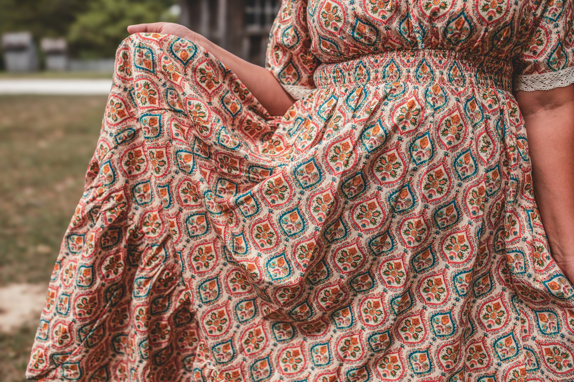 Woman wearing a patterned modest nursing dress