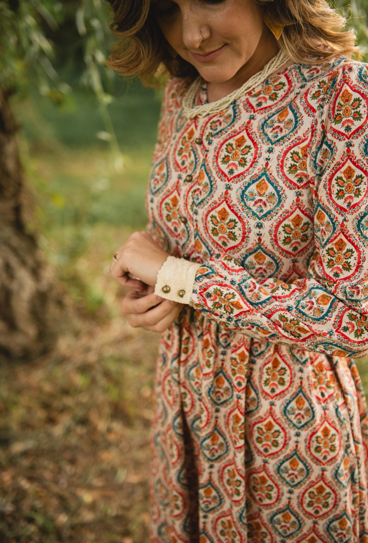 Woman wearing a patterned modest nursing dress