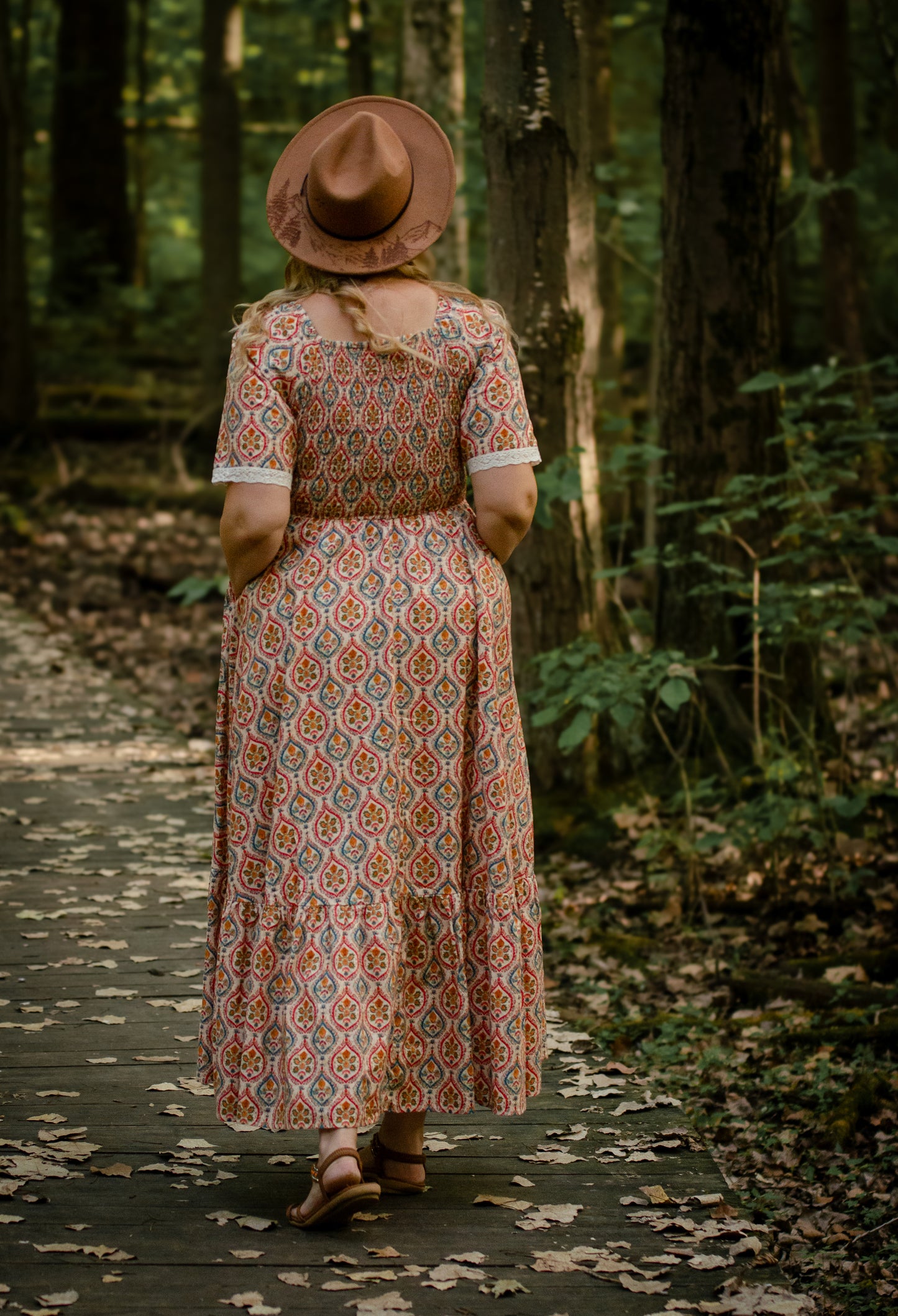 Woman wearing a patterned modest nursing dress