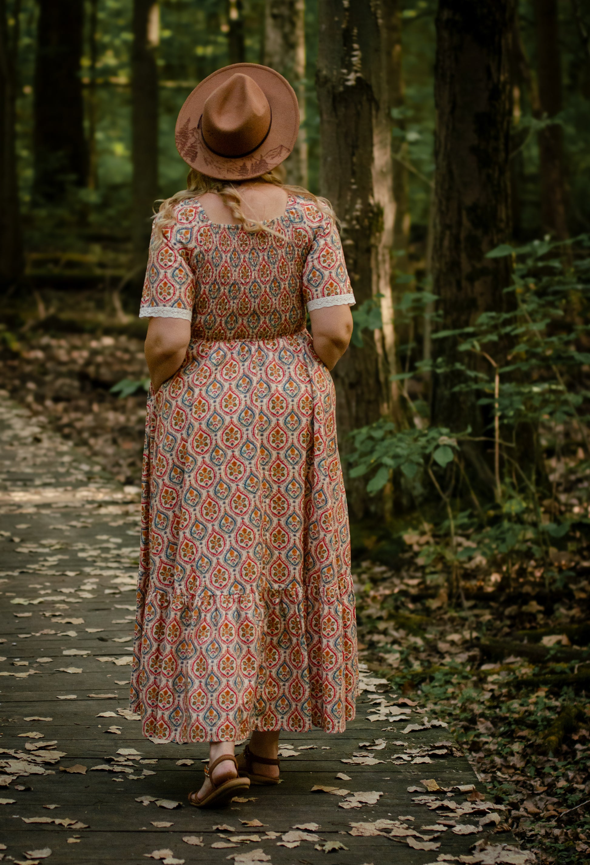 Woman wearing a patterned modest nursing dress