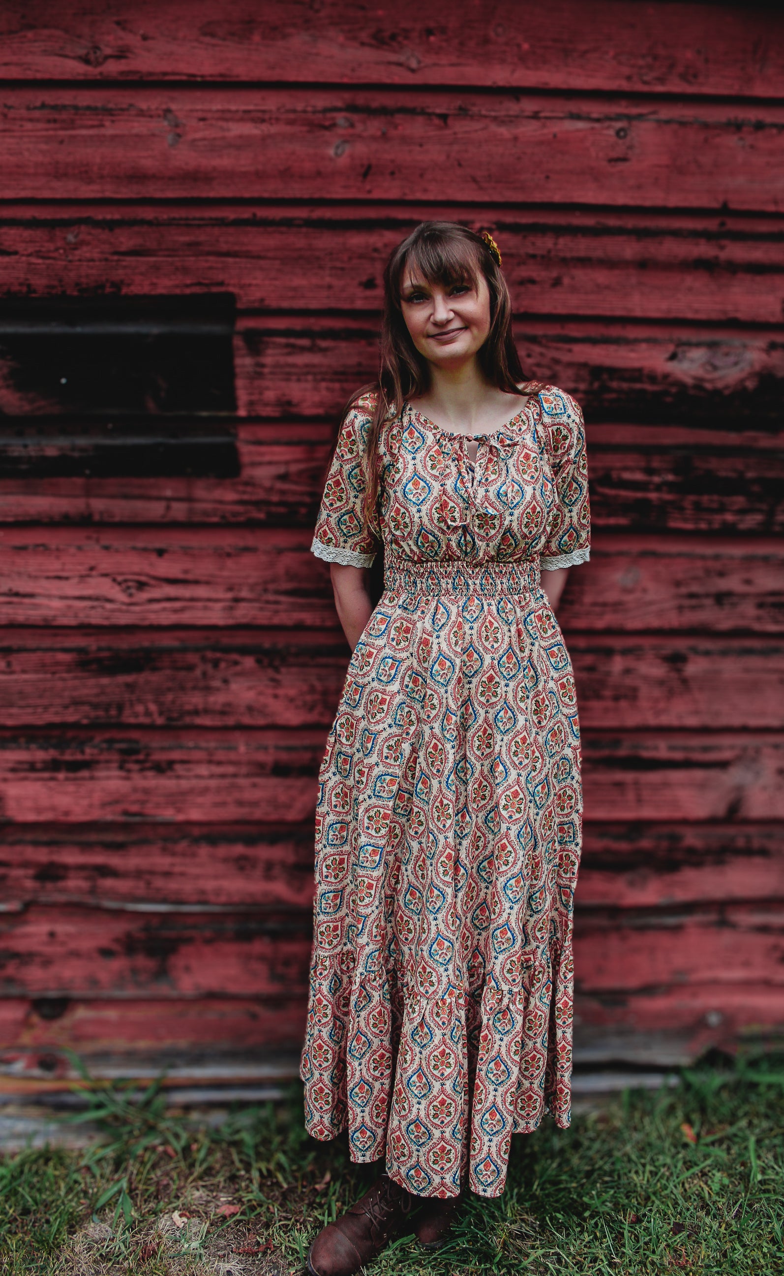 Woman wearing a patterned modest nursing dress
