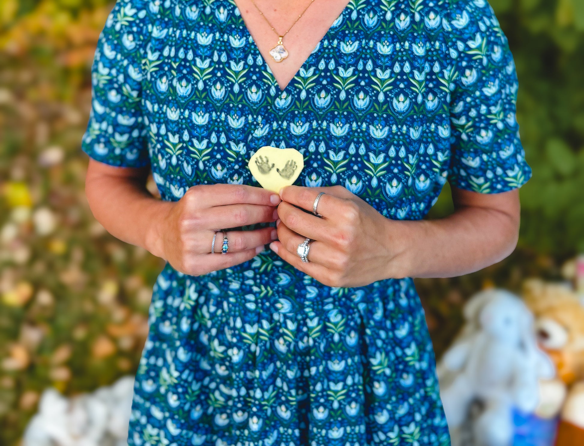 Woman in modest nursing dress holding object