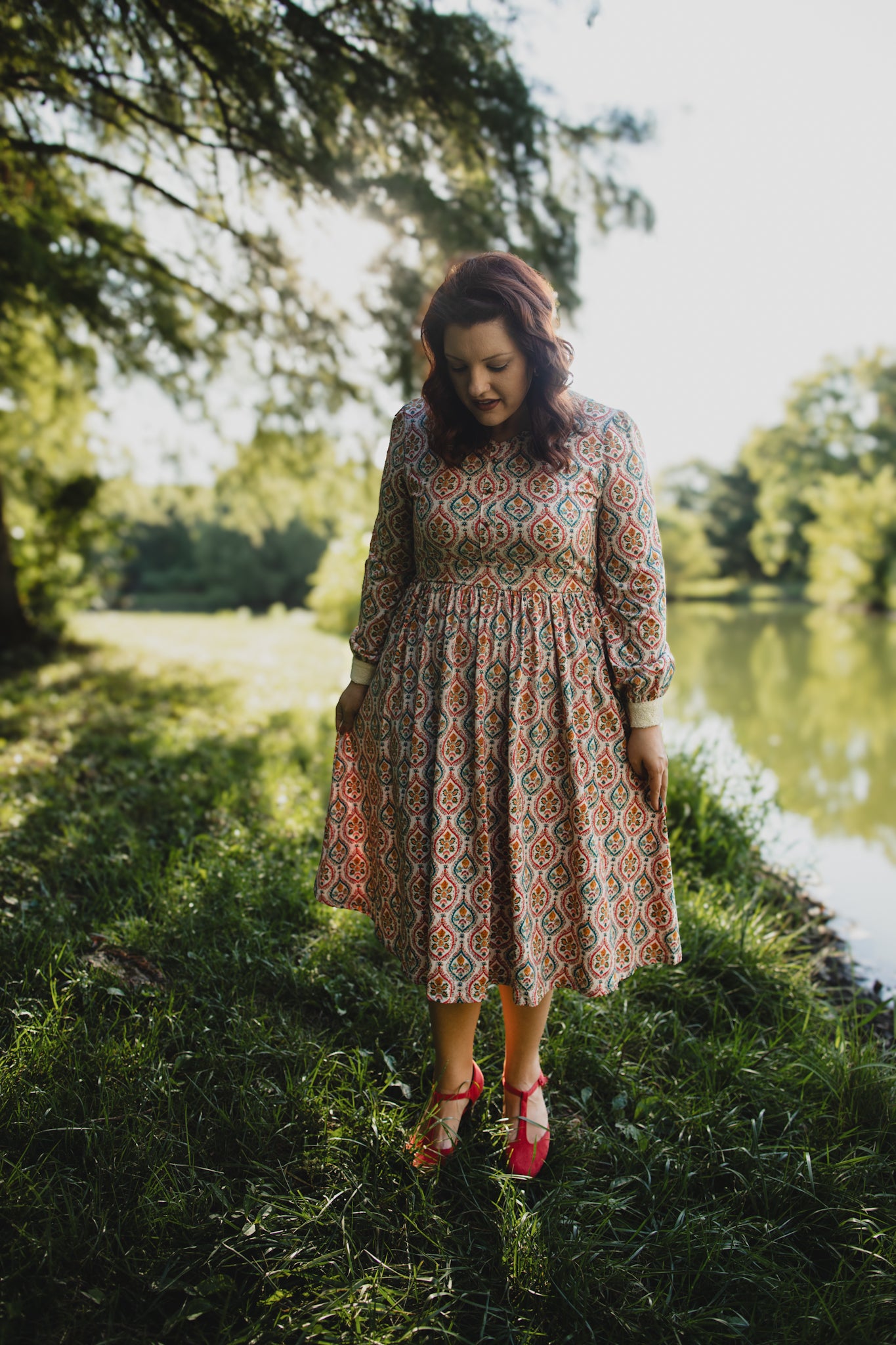 Woman wearing a patterned modest nursing dress