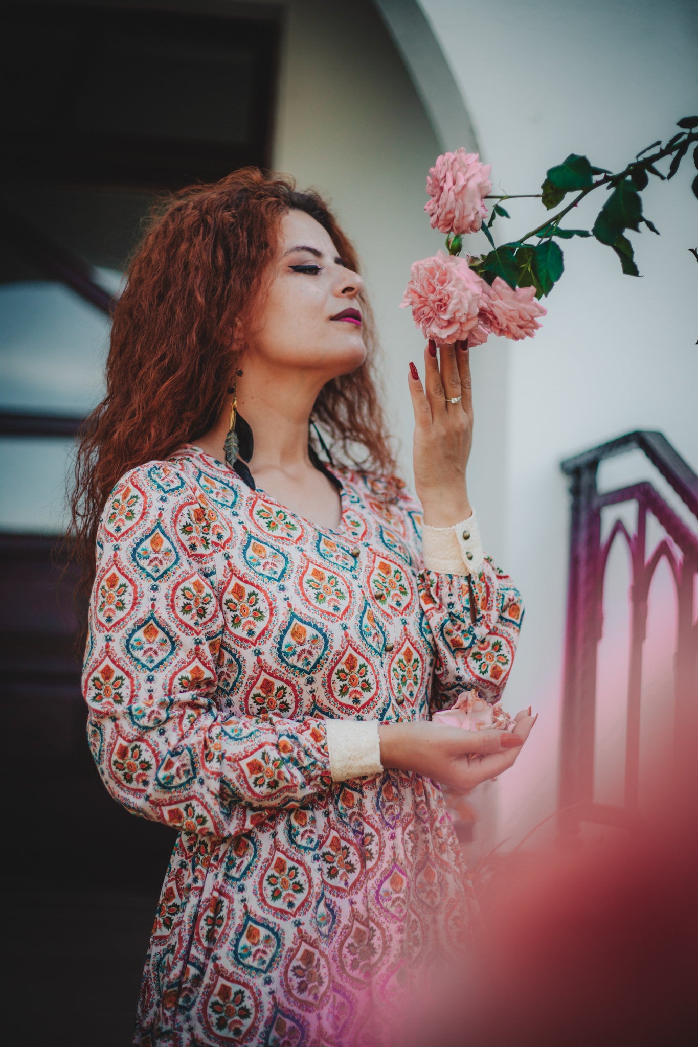 Woman wearing a patterned modest nursing dress