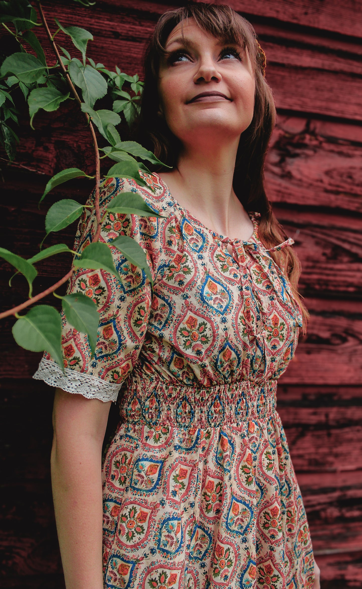 Woman wearing a patterned modest nursing dress