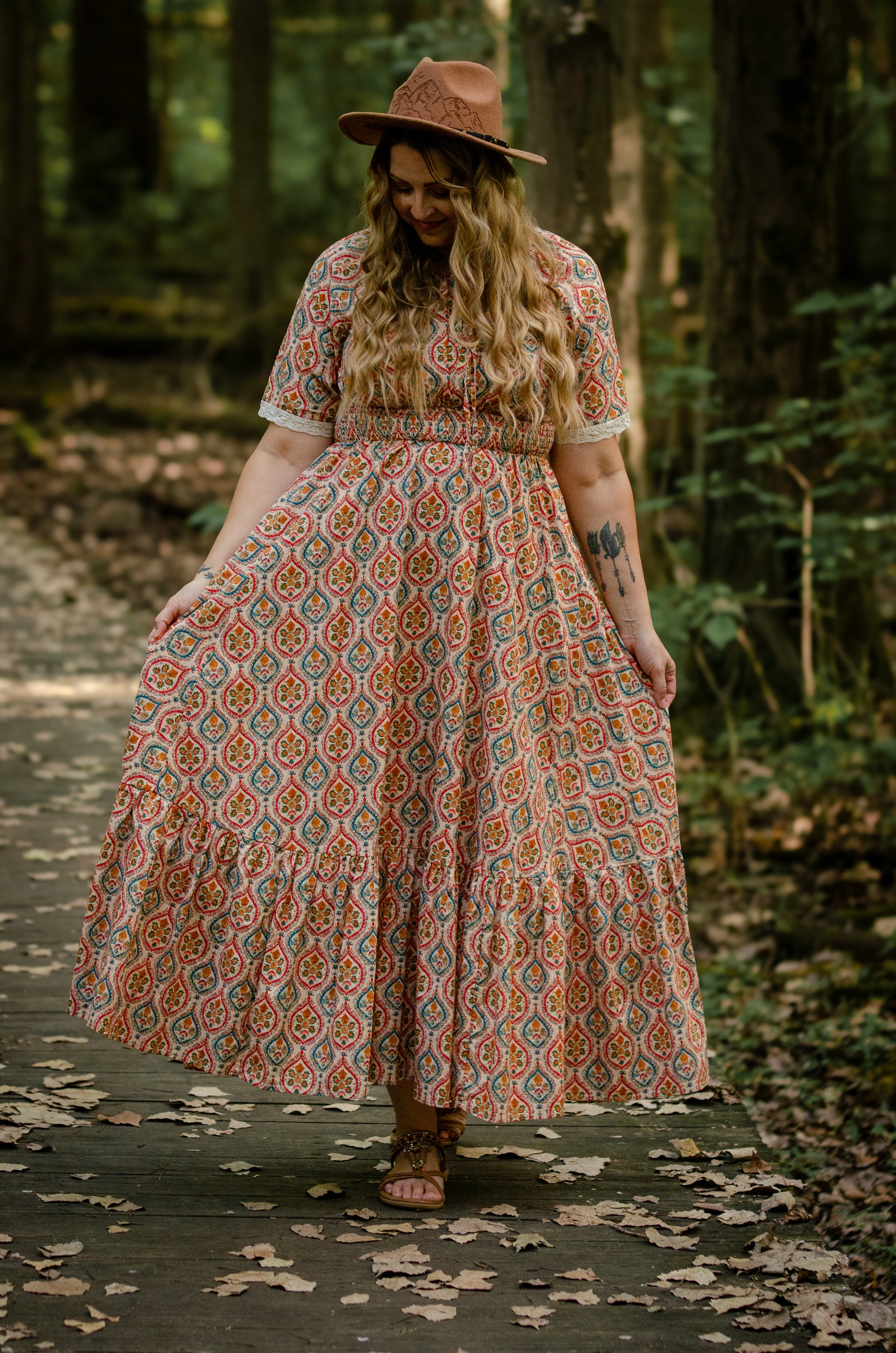 Woman wearing a patterned modest nursing dress