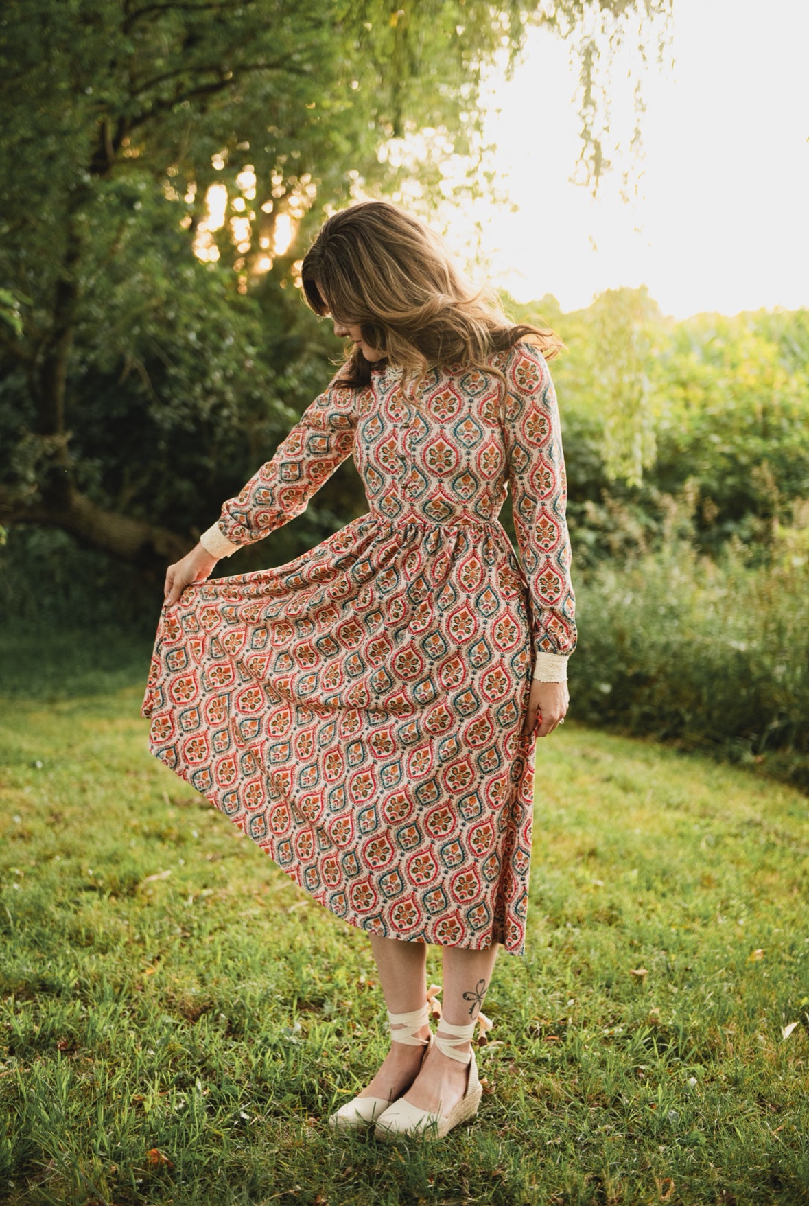 Woman wearing a patterned modest nursing dress