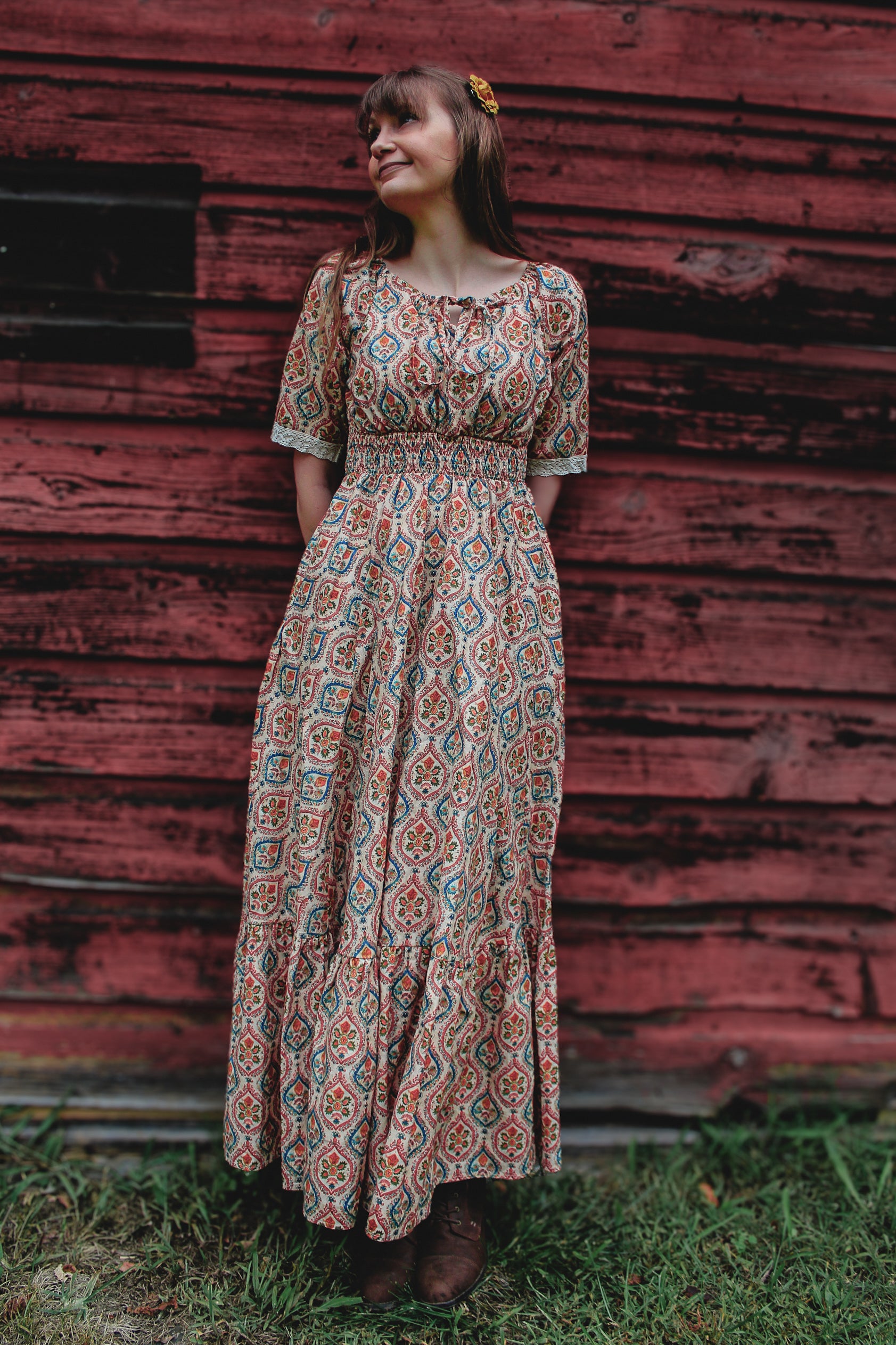 Woman wearing a patterned modest nursing dress