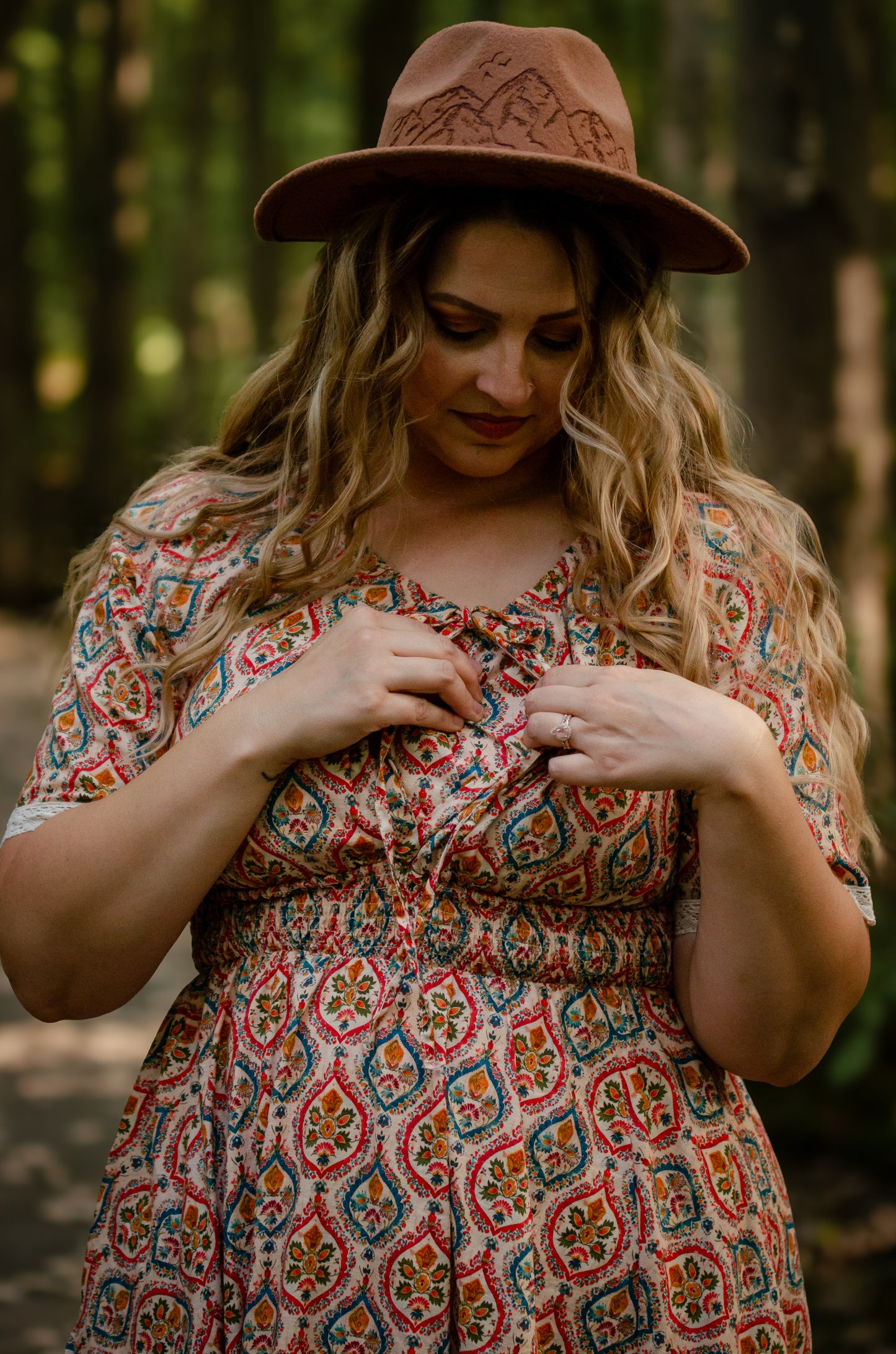 Woman wearing a patterned modest nursing dress