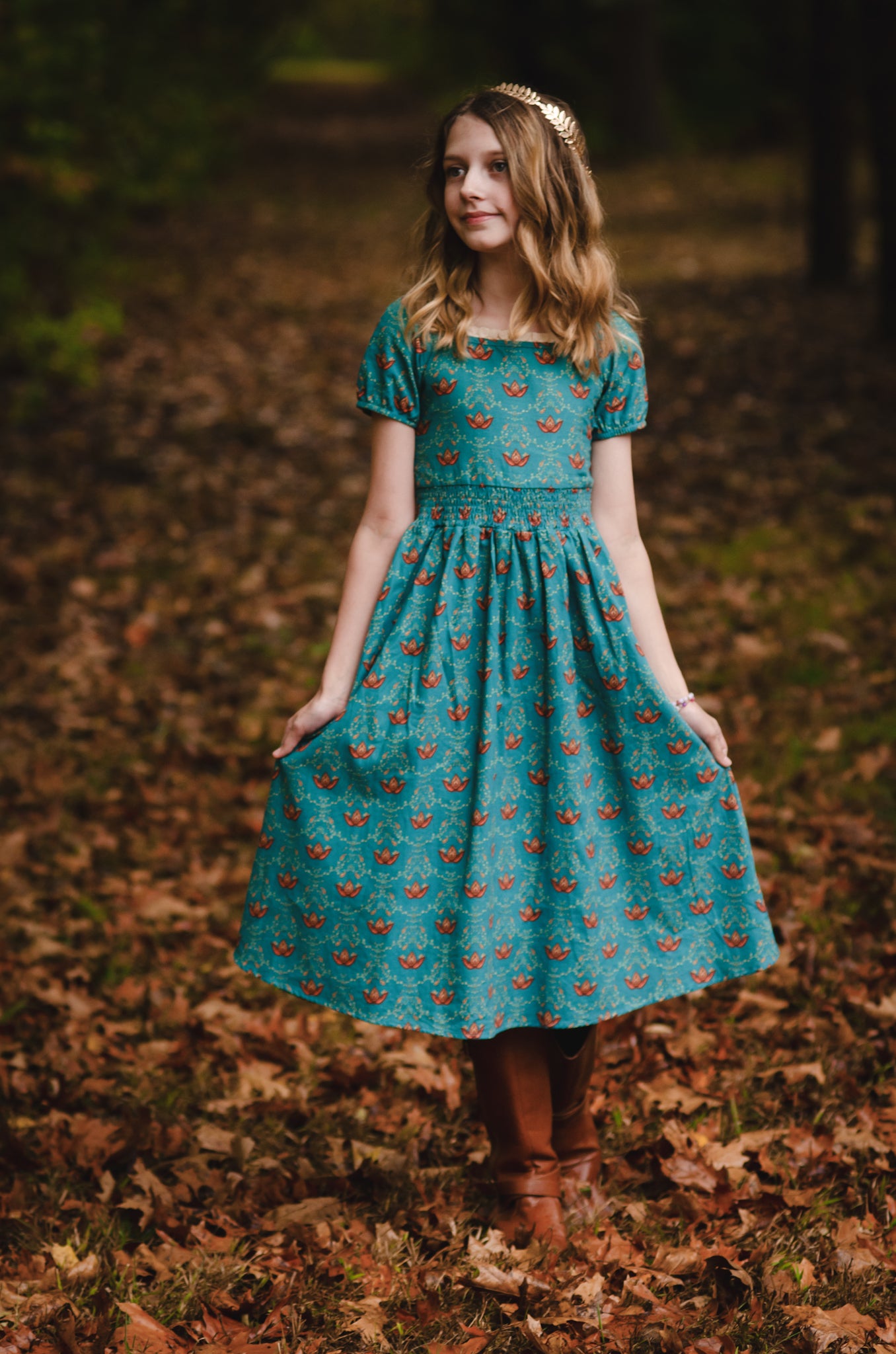 Woman wearing modest nursing dress with floral pattern.