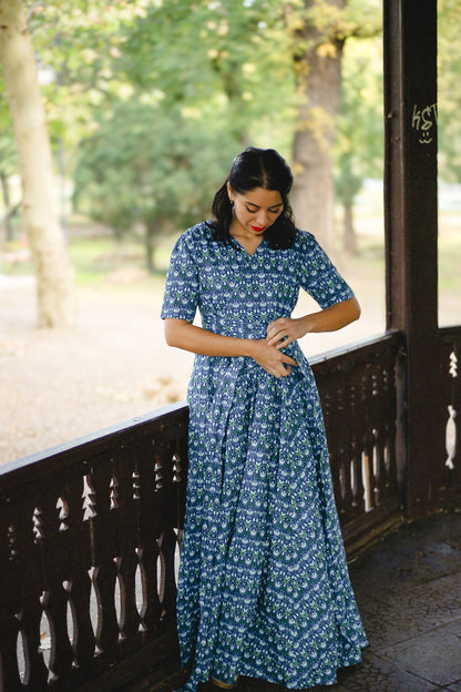 Woman in modest nursing dress on porch
